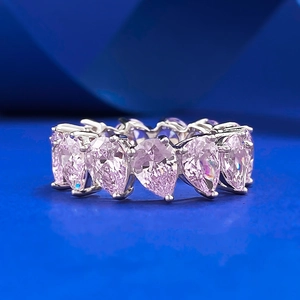 Eternity ring with pear-cut pink diamonds in S925 silver setting on blue background