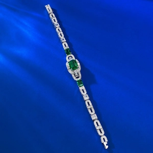 Art Deco S925 silver bracelet featuring emerald green gemstones and clear zircon accents