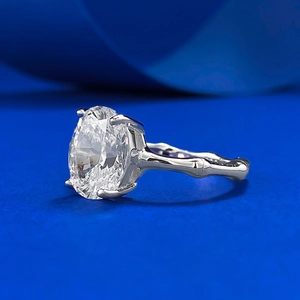 Macro side view of S925 silver oval cut diamond ring with unique bamboo textured band