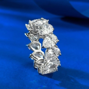 Macro view of S925 silver ring featuring full pear-cut diamond pavé setting