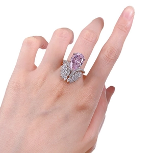 Luxurious S925 silver ring featuring a pear-shaped pink diamond and marquise side stones