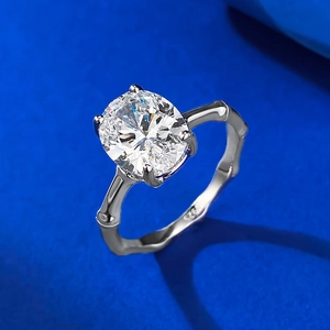 Elegant S925 sterling silver ring with oval diamond and bamboo textured band on blue silk