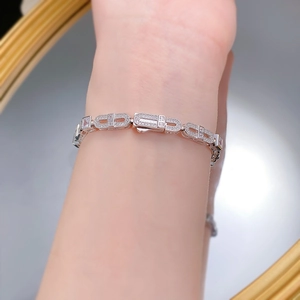 Detail of S925 silver bracelet with pavé-set cubic zirconia and rectangle link design