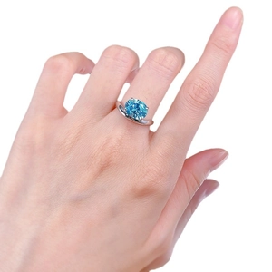 Elegant 925 silver ring featuring 8x10mm oval sea blue carbon diamond with modern twist band