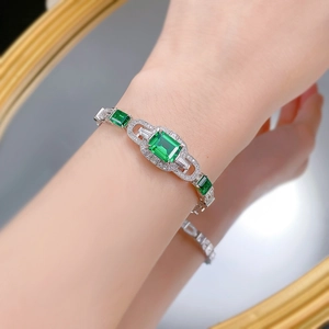 Luxurious S925 silver bracelet featuring emerald-cut green stones and zircon accents