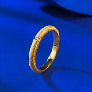 Detail of S925 sterling silver brushed gold ring with small diamond and hallmark