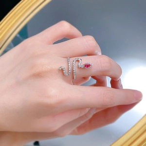Detailed view of S925 silver snake ring featuring pear-cut red stone and sparkling accents