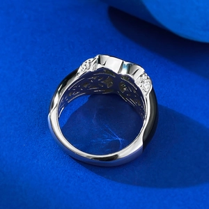 Macro view of S925 silver ring featuring intricate hollow patterns and pave zircon stones
