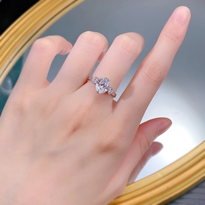 Elegant S925 silver ring featuring an oval-cut center stone and side accents on a finger