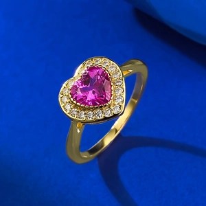 Elegant S925 silver ring featuring a peach pink heart gemstone with gold finish