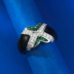 Vintage S925 silver ring with black enamel, white zircon, and green gemstone on stand