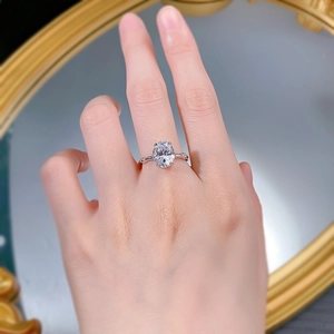 Detail of S925 silver ring featuring an oval cut diamond and textured bamboo band design