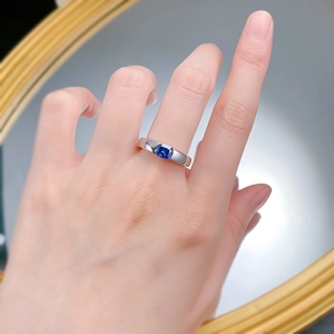 On-finger view of a square royal blue gemstone ring in a polished silver setting