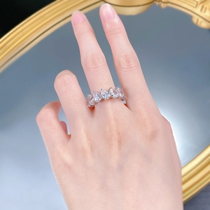 On-hand view of a sparkling S925 silver ring featuring pear-cut teardrop diamonds