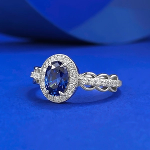 Classic silver ring with oval blue sapphire and pavé cubic zirconia accents