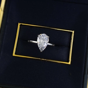 Elegant S925 silver ring featuring a 7x11mm pear cut white cubic zirconia in a blue gift box