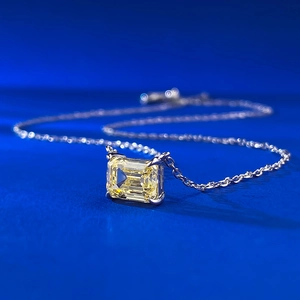 Elegant S925 silver necklace with an emerald-cut yellow diamond pendant on blue background