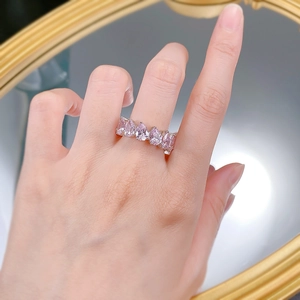 Close-up of S925 silver ring featuring pink pear-cut crystals in a luxe pavé setting