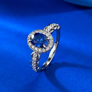 S925 sterling silver ring with oval blue sapphire and pavé-set cubic zirconia accents