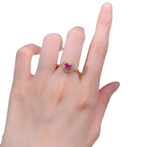 S925 silver gold ring with heart-cut peach pink gemstone and zircon halo on finger