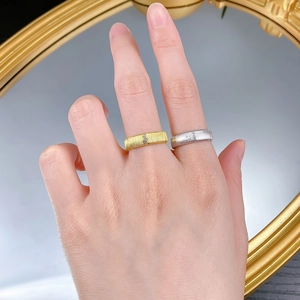 Detail of S925 sterling silver brushed rings with micro-pave zircon row on hands