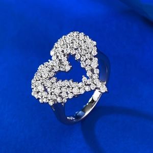 Macro shot of S925 sterling silver ring with a sparkling hollow heart pavé setting