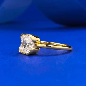 Modern 18K gold ring with a square-cut white gemstone shown from a 45-degree angle
