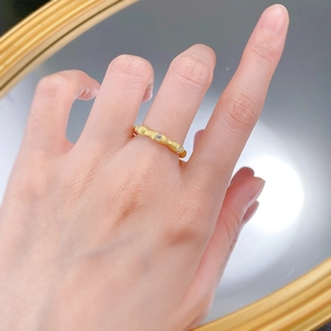 Detailed macro view of S925 silver bamboo ring with gold plating and sparkling zircon