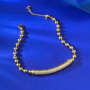 Detailed close-up of S925 sterling silver gold-plated beaded bracelet with cubic zirconia
