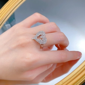 Detailed close-up of a heart-shaped S925 silver ring with pavé-set sparkling zircons
