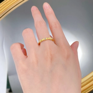 Detail of bamboo joint texture ring in gold-plated silver with sparkling cubic zirconia