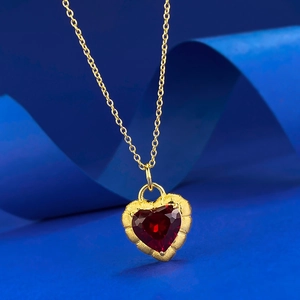 Elegant gold-plated S925 silver necklace with heart-shaped garnet pendant on blue background