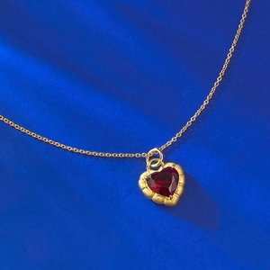 Elegant gold-plated S925 silver necklace featuring a heart-shaped red garnet stone pendant