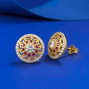 S925 silver gold-plated hollow floral stud earrings with red ruby-style center stones