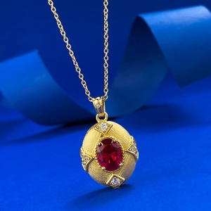 Retro gold brushed S925 silver necklace featuring an oval red garnet pendant