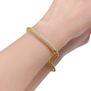 Sparkling gold-tone bead bracelet with pavé crystal cylinder for a modern minimalist look