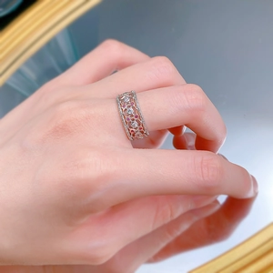 Detailed macro view of S925 silver vintage lace ring with purple gems on a finger