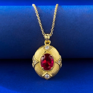 S925 sterling silver gold plated garnet necklace featuring brushed oval pendant design