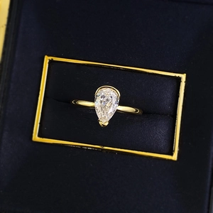 Pear cut white diamond ring in gold plated S925 silver on navy velvet jewelry box