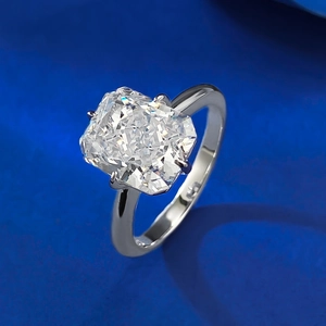 Radiant cut carbon diamond ring in S925 silver setting on a royal blue background