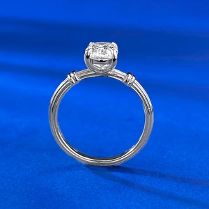 Macro shot of S925 silver ring featuring a four-prong set solitaire gem with textured band