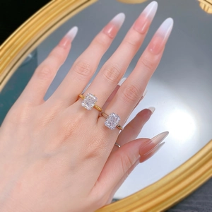 Close-up of gold and silver S925 rings featuring large ice-flower radiant cut stones