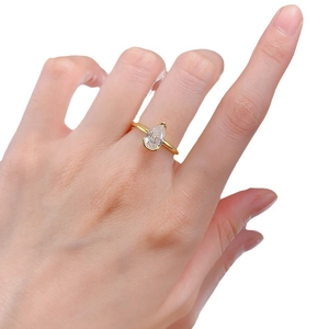 Elegant gold S925 silver ring featuring a 6x9mm pear-cut radiant white gemstone on hand