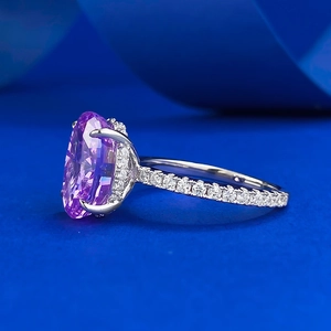 Close-up of S925 silver ring featuring an oval radiant cut purple stone and side diamonds