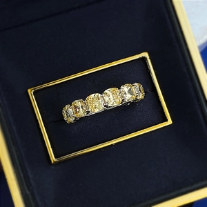 S925 silver ring featuring seven yellow cushion-cut gemstones in a blue gift box