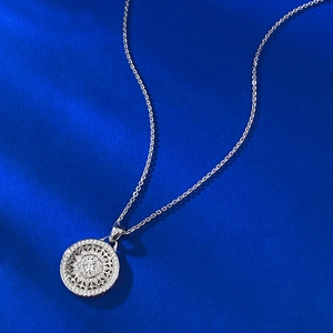 Elegant S925 sterling silver spinning mandala compass pendant necklace on blue background
