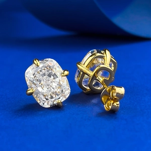 Detail of 925 silver gold-plated studs with radiant cut cubic zirconia stones