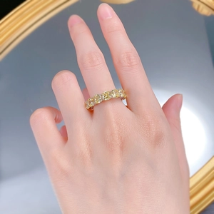 Detailed view of S925 silver ring featuring cushion cut yellow stones in a stackable band