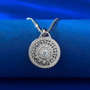 Macro detail of silver S925 spinning compass pendant with zircon stones and link chain