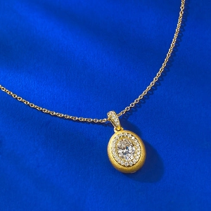 Elegant gold-plated S925 silver oval pendant necklace with brushed texture and crystal detail
